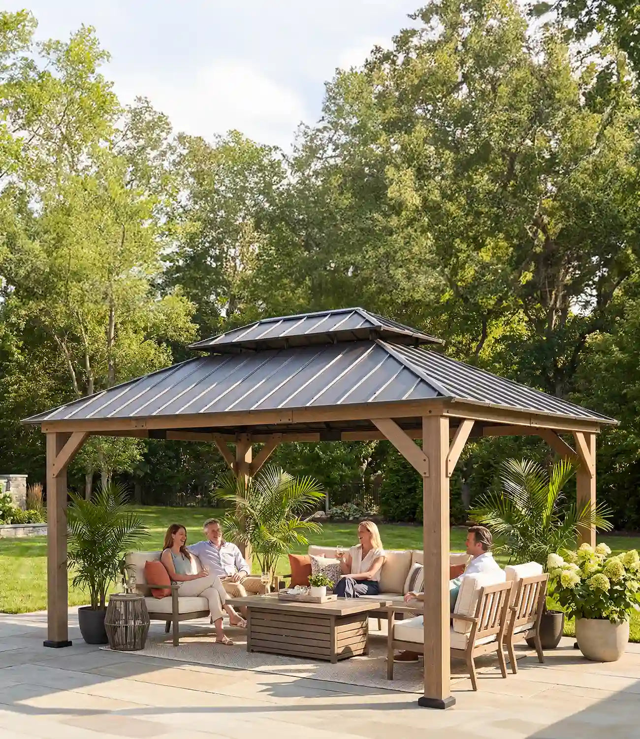 A family sitting under a hardtop gazebo